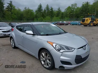 2016 Hyundai Veloster z VIN KMHTC6AD2GU277109, wystawiony jako IAAI lot #42312969 z przebiegiem 132 899 mil mil oraz . Historia ofert i sprzedaży dostępna na DreamBid. Obrazek 1.