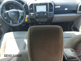 2019 Ford F-150 XL with VIN 1FTEW1EP7KFA47638, listed as a Copart auction lot 60193125 with 127,022 mi miles and Salvage title. Bid and sale history available at DreamBid. Image 8.