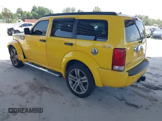 2011 Dodge Nitro z VIN 1D4PU6GX5BW512588, wystawiony jako IAAI lot #42471965 z przebiegiem 115 827 mil mil oraz . Historia ofert i sprzedaży dostępna na DreamBid. Obrazek 3.