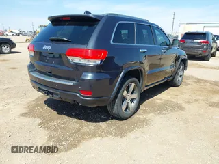 2015 Jeep Grand Cherokee Overland with VIN 1C4RJECG3FC635327, listed as a IAAI auction lot 41910559 with 118,519 mi miles and . Bid and sale history available at DreamBid. Image 4.