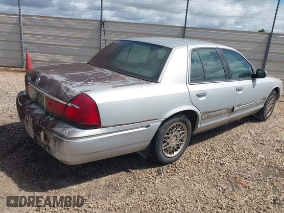 2002 Mercury Grand Marquis GS z VIN 2MEFM74W92X607734, wystawiony jako IAAI lot #42413400 z przebiegiem 209 565 mil mil oraz . Historia ofert i sprzedaży dostępna na DreamBid. Obrazek 4.