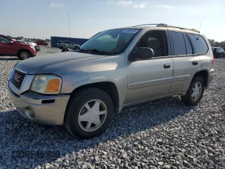 2003 GMC Envoy SLT z VIN 1GKDS13S032373020, wystawiony jako Copart lot #54986765 z przebiegiem 235 711 mil mil oraz Tytuł czysty. Historia ofert i sprzedaży dostępna na DreamBid. Obrazek 1.
