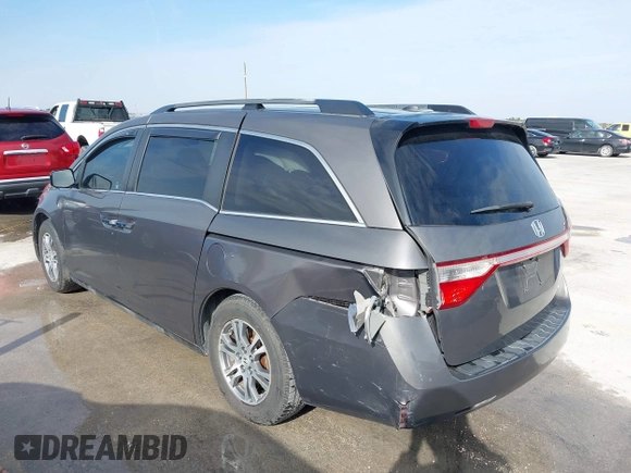 2012 Honda Odyssey EX-L with VIN 5FNRL5H60CB094682, listed as a IAAI auction lot 41570797 with 127,890 mi miles and . Bid and sale history available at carsss.com. Image 3.