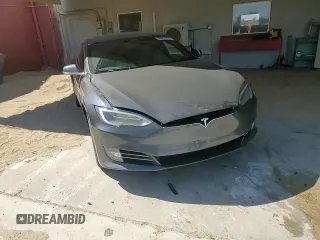 2017 Tesla Model S 60 z VIN 5YJSA1E18HF192715, wystawiony jako Copart lot #56851225 z przebiegiem 103 231 mil mil oraz Szkoda całkowita • Salvage title. Historia ofert i sprzedaży dostępna na DreamBid. Obrazek 13.