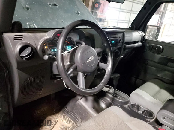 2007 Jeep Wrangler Sahara with VIN 1J4FA54127L127598, listed as a Copart auction lot 44049475 with 222,867 mi miles and Salvage title. Bid and sale history available at DreamBid. Image 8.