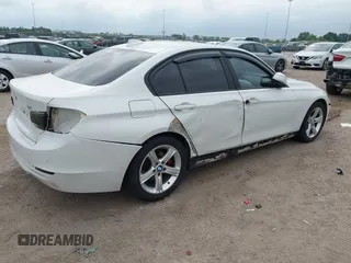 2012 BMW 3 Series 328i with VIN WBA3A5C51CF349987, listed as a IAAI auction lot 42013599 with 256,461 mi miles. Bid and sale history available at carsss.com. Image 4.