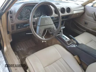 1980 Datsun 280ZX z VIN HS130221335, wystawiony jako Copart lot #81964444 z przebiegiem 135 266 mil mil oraz Szkody całkowita. Historia ofert i sprzedaży dostępna na DreamBid. Obrazek 8.