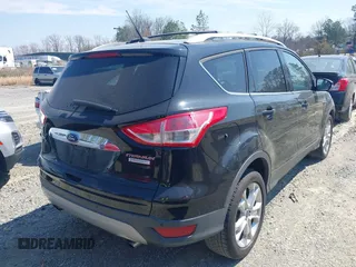 2016 Ford Escape Titanium with VIN 1FMCU0JX8GUC06601, listed as a IAAI auction lot 41785774 with 121,427 mi miles. Bid and sale history available at carsss.com. Image 4.