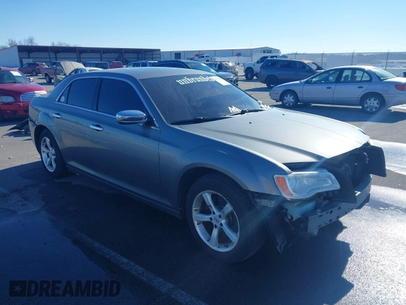 2011 Chrysler 300 with VIN 2C3CA6CTXBH563112, listed as a IAAI auction lot 41374372 with 151,947 mi miles. Bid and sale history available at carsss.com. Image 1.