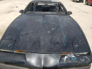 1987 Pontiac Firebird z VIN 1G2FS2184HL222415, wystawiony jako Copart lot #54878805 z przebiegiem 97 287 mil mil oraz Szkody całkowita. Historia ofert i sprzedaży dostępna na DreamBid. Obrazek 11.