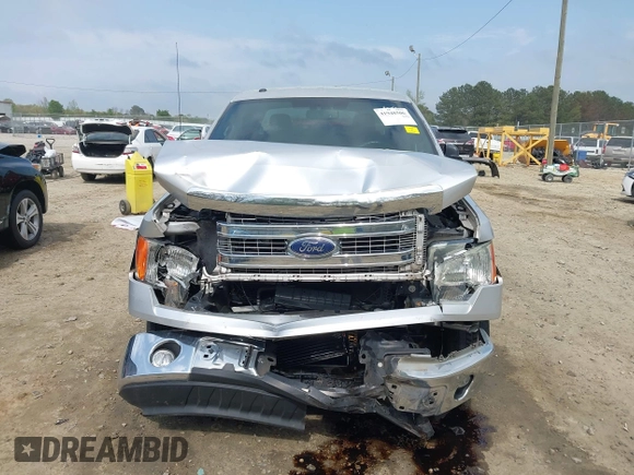 2013 Ford F-150 XL z VIN 1FTFW1CT3DFD91054, wystawiony jako IAAI lot #41948506 z przebiegiem 181 197 mil mil oraz . Historia ofert i sprzedaży dostępna na DreamBid. Obrazek 12.
