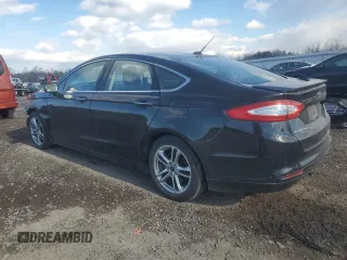 2016 Ford Fusion Titanium Hybrid with VIN 3FA6P0RU1GR100099, listed as a Copart auction lot 88540565 with 232,915 mi miles and Salvage Title. Bid and sale history available at carsss.com. Image 2.