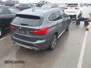 2019 BMW X1 sDrive28i with VIN WBXHU7C52K5L12160, listed as a IAAI auction lot 41452244 with 59,344 mi miles and . Bid and sale history available at DreamBid. Image 4.