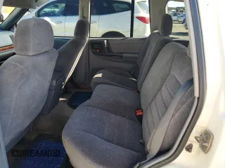 1996 Jeep Grand Cherokee Laredo with VIN 1J4FX58SXTC349575, listed as a Copart auction lot 80545584 with 302,636 mi miles and Salvage Title. Bid and sale history available at carsss.com. Image 10.