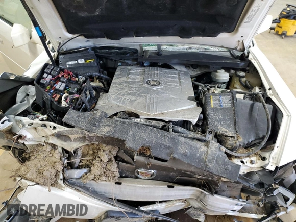 2006 Cadillac CTS z VIN 1G6DP577660112875, wystawiony jako Copart lot #87670565 z przebiegiem Nie podano mil oraz Szkoda całkowita • Salvage title. Historia ofert i sprzedaży dostępna na DreamBid. Obrazek 12.