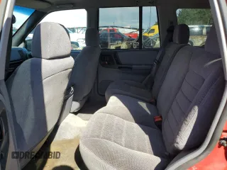 1996 Jeep Grand Cherokee Laredo with VIN 1J4GZ58S0TC170623, listed as a Copart auction lot 68019014 with 174,192 mi miles and Salvage Title. Bid and sale history available at carsss.com. Image 11.