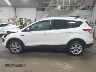 2014 Ford Escape Titanium with VIN 1FMCU9J90EUD21552, listed as a IAAI auction lot 42102148 with 183,539 mi miles. Bid and sale history available at carsss.com. Image 14.