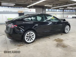 2023 Tesla Model 3 with VIN 5YJ3E1EA5PF439017, listed as a Copart auction lot 53694145 with 73,875 mi miles and Salvage Title. Bid and sale history available at DreamBid. Image 3.