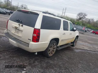 2010 Chevrolet Suburban LTZ with VIN 1GNUKKE35AR129351, listed as a IAAI auction lot 41971625 with 234,487 mi miles. Bid and sale history available at carsss.com. Image 4.