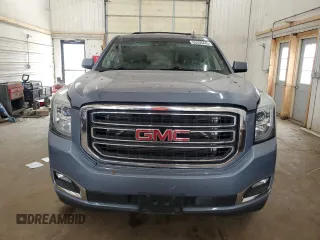 2015 GMC Yukon SLT z VIN 1GKS2BKC0FR630731, wystawiony jako Copart lot #55359445 z przebiegiem Nie podano mil oraz Szkoda całkowita • Salvage title. Historia ofert i sprzedaży dostępna na DreamBid. Obrazek 5.