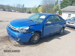 2010 Ford Focus SE with VIN 1FAHP3FNXAW159048, listed as a IAAI auction lot 42103062 with 142,810 mi miles. Bid and sale history available at carsss.com. Image 2.