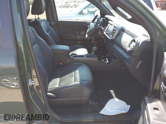 2022 Toyota Tacoma SR with VIN 3TMCZ5AN0NM470396, listed as a IAAI auction lot 41909515 with 35,997 mi miles and . Bid and sale history available at DreamBid. Image 5.