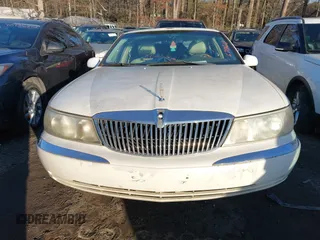 2001 Lincoln Continental with VIN 1LNHM97V71Y670611, listed as a IAAI auction lot 41385621 with 141,714 mi miles. Bid and sale history available at carsss.com. Image 6.