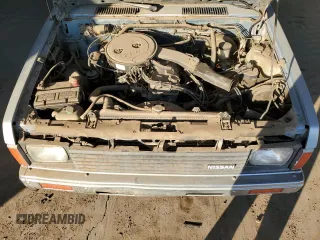 1988 Nissan Hardbody z VIN 1N6ND11S8JC370741, wystawiony jako Copart lot #84060304 z przebiegiem 131 488 mil mil oraz Tytuł czysty. Historia ofert i sprzedaży dostępna na DreamBid. Obrazek 11.