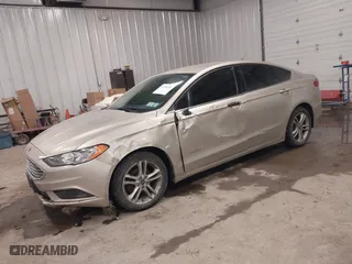 2018 Ford Fusion Hybrid S with VIN 3FA6P0UU5JR100377, listed as a IAAI auction lot 41300284 with 108,936 mi miles. Bid and sale history available at carsss.com. Image 2.