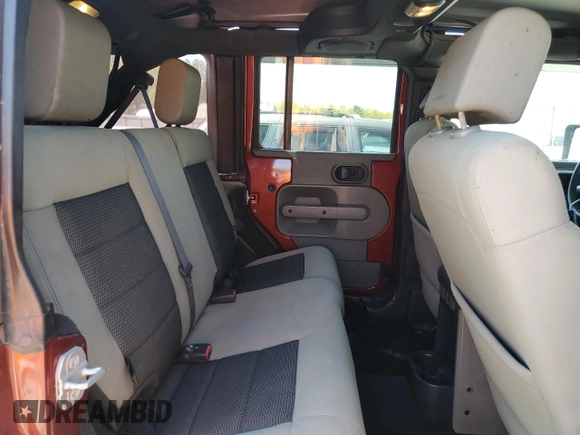 2010 Jeep Wrangler Unlimited Sahara with VIN 1J4BA5H11AL107228, listed as a Copart auction lot 54761705 with 102,816 mi miles and Clean Title. Bid and sale history available at carsss.com. Image 11.
