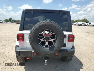 2020 Jeep Wrangler Unlimited Rubicon with VIN 1C4HJXFG3LW184249, listed as a Copart auction lot 56423665 with 63,111 mi miles and Salvage title. Bid and sale history available at DreamBid. Image 6.