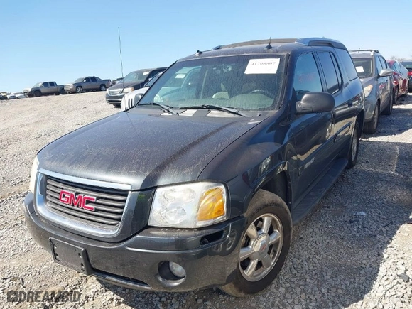 2004 GMC Envoy SLE with VIN 1GKDS13S242370041, listed as a IAAI auction lot 41698413 with 158,160 mi miles. Bid and sale history available at carsss.com. Image 2.