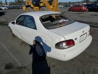 1999 Mazda 626 LX with VIN 1YVGF22D4X5882600, listed as a Copart auction lot 69031604 with 0 mi miles and Salvage Title. Bid and sale history available at carsss.com. Image 2.