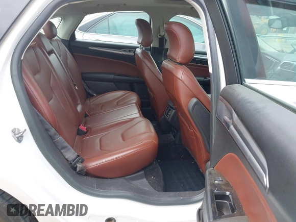 2016 Ford Fusion Titanium Hybrid with VIN 3FA6P0RU3GR190355, listed as a IAAI auction lot 42384309 with 157,172 mi miles and . Bid and sale history available at DreamBid. Image 8.