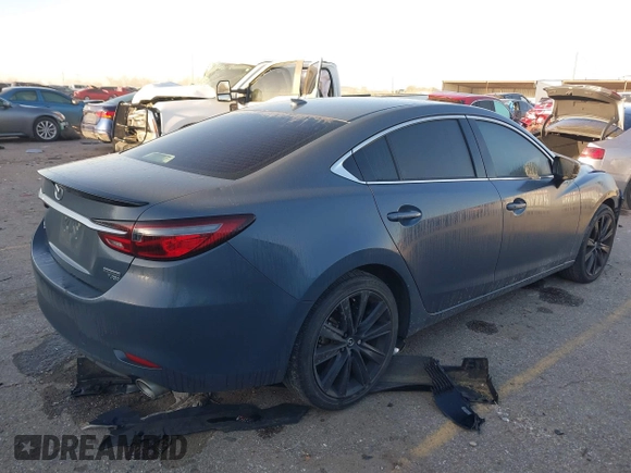 2021 Mazda 6 Carbon Edition with VIN JM1GL1WY9M1619981, listed as a IAAI auction lot 41751194 with 32,083 mi miles and . Bid and sale history available at DreamBid. Image 4.