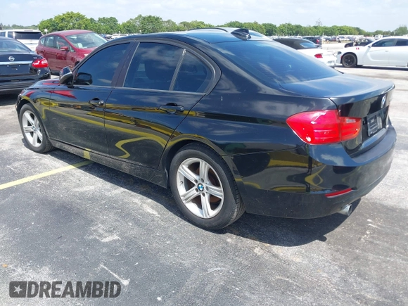 2014 BMW 3 Series 320i with VIN WBA3B1C55EK135357, listed as a IAAI auction lot 42158550 with 148,911 mi miles. Bid and sale history available at carsss.com. Image 3.
