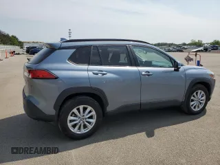 2023 Toyota Corolla Cross LE with VIN 7MUCAABG4PV054828, listed as a Copart auction lot 59466855 with 23,884 mi miles and Salvage title. Bid and sale history available at DreamBid. Image 3.