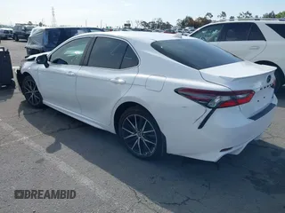 2022 Toyota Camry SE with VIN 4T1G11AKXNU070473, listed as a IAAI auction lot 41937541 with 57,598 mi miles and . Bid and sale history available at DreamBid. Image 3.