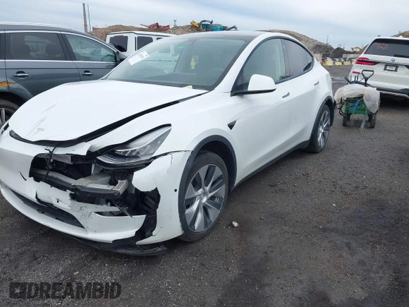 2022 Tesla Model Y Long Range z VIN 7SAYGDEE7NF389788, wystawiony jako IAAI lot #42014111 z przebiegiem 37 606 mil mil oraz . Historia ofert i sprzedaży dostępna na DreamBid. Obrazek 2.