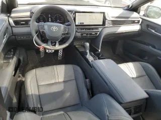 2025 Toyota Camry LE with VIN 4T1DAACKXSU052793, listed as a Copart auction lot 50166545 with 8,577 mi miles and Salvage Title. Bid and sale history available at DreamBid. Image 8.