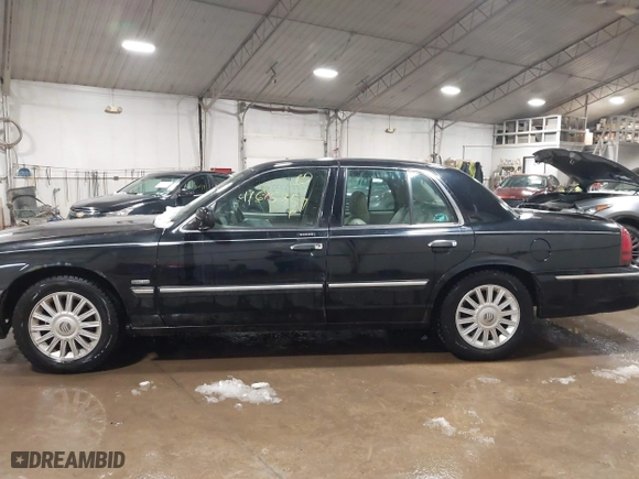 2009 Mercury Grand Marquis LS with VIN 2MEHM75V39X602084, listed as a IAAI auction lot 41615859 with 102,051 mi miles. Bid and sale history available at carsss.com. Image 14.