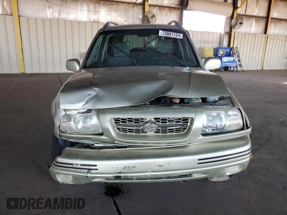 1999 Suzuki Grand Vitara JLX z VIN JS3TD62V3X4123048, wystawiony jako Copart lot #73007124 z przebiegiem 159 828 mil mil oraz Szkoda całkowita • Salvage title. Historia ofert i sprzedaży dostępna na DreamBid. Obrazek 5.