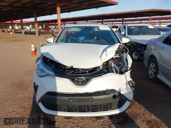 2021 Toyota C-HR LE with VIN JTNKHMBX3M1114590, listed as a IAAI auction lot 41560459 with 61,803 mi miles. Bid and sale history available at carsss.com. Image 12.