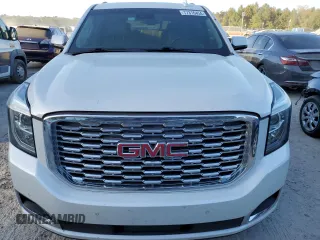 2019 GMC Yukon Denali with VIN 1GKS1CKJ8KR353280, listed as a Copart auction lot 77316454 with 74,476 mi miles and Salvage Title. Bid and sale history available at carsss.com. Image 5.