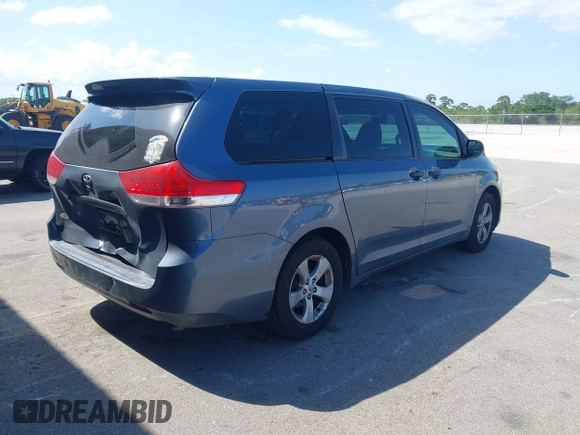 2014 Toyota Sienna L with VIN 5TDZK3DC2ES493997, listed as a IAAI auction lot 41996586 with 192,297 mi miles. Bid and sale history available at carsss.com. Image 4.