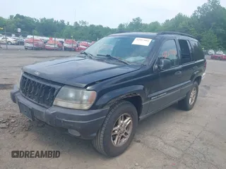 2003 Jeep Grand Cherokee Laredo with VIN 1J4GW48S03C557756, listed as a IAAI auction lot 42507884 with 195,236 mi miles and . Bid and sale history available at DreamBid. Image 2.