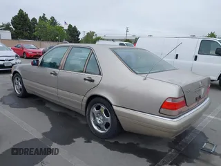 1997 Mercedes-Benz S-Class with VIN WDBGA32G1VA349367, listed as a IAAI auction lot 42079132 with 383,250 mi miles. Bid and sale history available at carsss.com. Image 3.