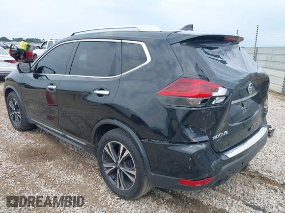 2018 Nissan Rogue SV with VIN JN8AT2MT8JW465012, listed as a IAAI auction lot 39376292 with 184,861 mi miles and . Bid and sale history available at DreamBid. Image 3.