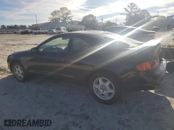 1997 Toyota Celica GT with VIN JT2DG02TXV0040610, listed as a Copart auction lot 79677454 with 179,749 mi miles and Salvage Title. Bid and sale history available at carsss.com. Image 2.