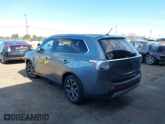 2015 Mitsubishi Outlander GT with VIN JA4JZ4AX1FZ005879, listed as a IAAI auction lot 41701299 with 212,805 mi miles and . Bid and sale history available at DreamBid. Image 3.